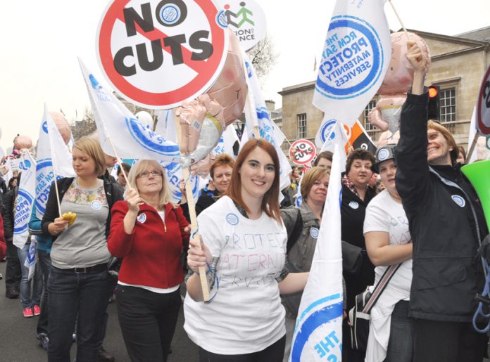 Nurses on a TUC demonstration demand no cuts to the NHS