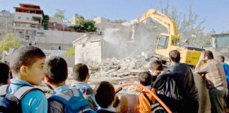 Bulldozer destroying Palestinian homes in East Jerusalem