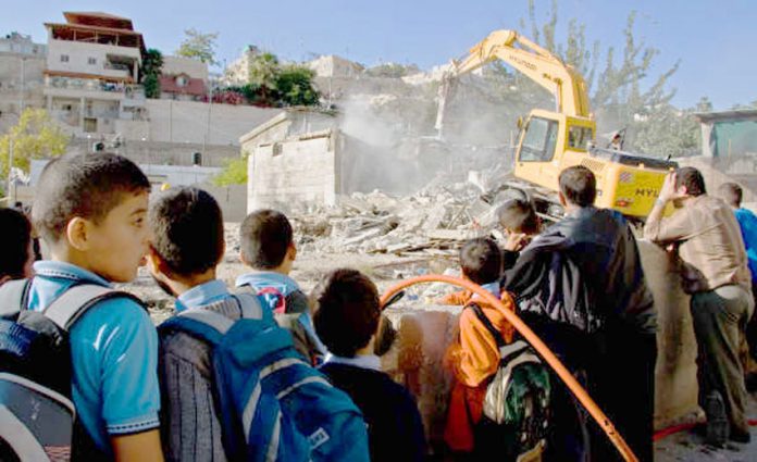 Bulldozer destroying Palestinian homes in East Jerusalem
