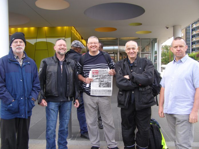 Striking London Underground power workers on their picket line opposite Southwark tube station early yesterday morning