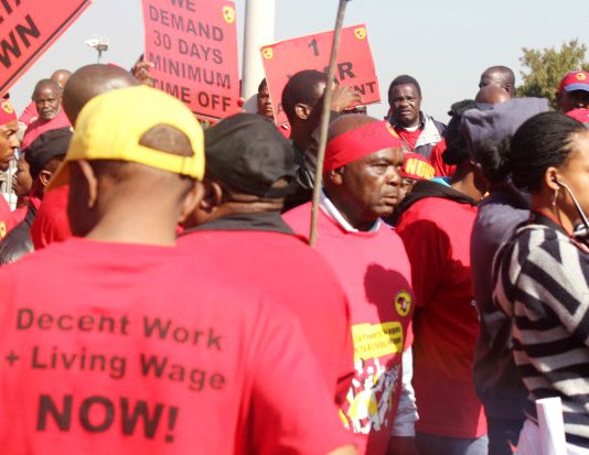 NUMSA members picketing Eskom’s Megawatt Park headquarters in Sunninghill, Johannesburg