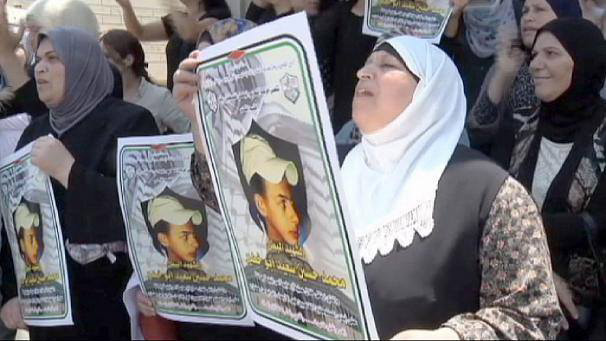 Palestinian women demonstrate against the killing of 15-year-old Muhammad Abu-Khudayr