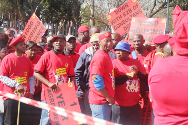 NUMSA members picket the Eskom power company head offices in Sunninghill on the outskirts of Johannesburg