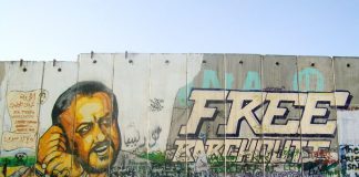 Mural depicting Marwan al-Barghouthi painted on the separation wall at the Qalandia checkpoint in Ramallah