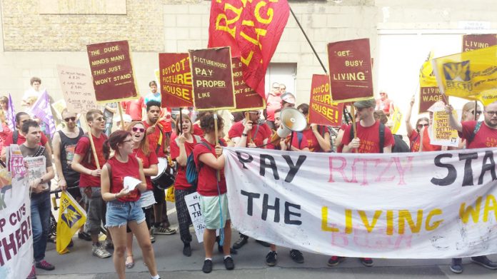 Ritzy and Curzon cinema workers marching to City Hall yesterday afternoon demanding the London Living Wage of £8.50 an hour