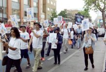 GPs and patients march through Tower Hamlets in defence of GP surgeries – nationally there are 98 surgeries under threat from funding cuts