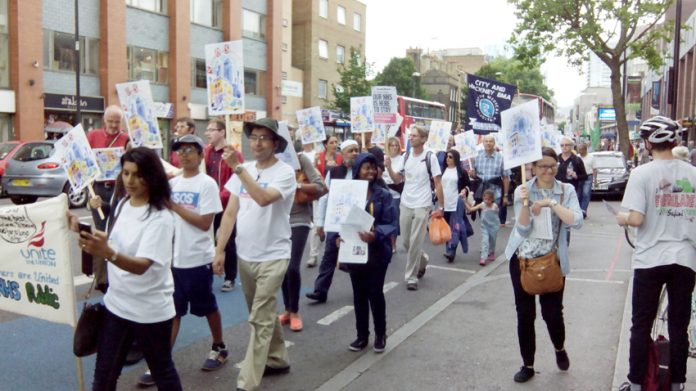 GPs and patients march through Tower Hamlets in defence of GP surgeries – nationally there are 98 surgeries under threat from funding cuts