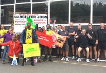 Firefighters greet the marchers at Studley Road Fire Station, Luton