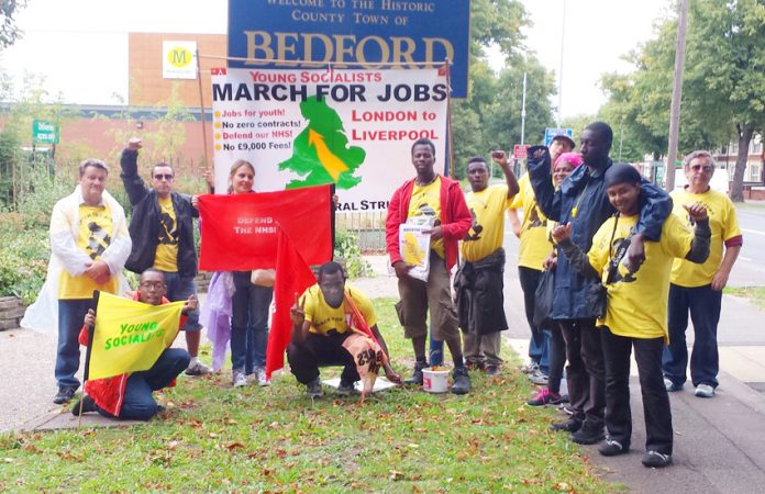 A section of the march celebrates reaching the outskirts of Bedford, expecting more of the great response they received in Luton