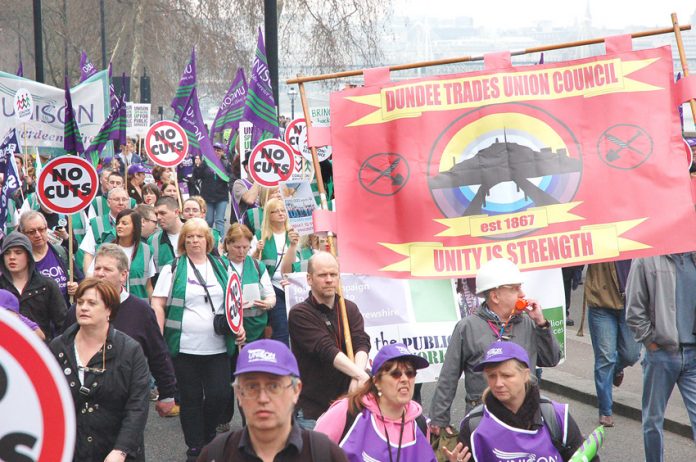 ‘Unity is strength’ – Scottish workers carrying the Dundee Trades Council banner marching alongside workers from England and Wales on the half-a-million-strong TUC demonstration against government cuts in March 2011