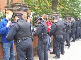 Youth on their way to the Notting Hill Carnival are stopped and searched by police