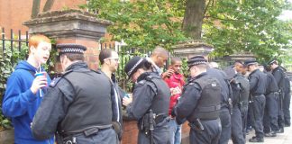 Youth on their way to the Notting Hill Carnival are stopped and searched by police