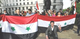 Syrians outside Downing Street in June stage their own ballot to elect their president after the British government refused to allow them to participate in the Syrian presidential elections