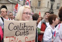 Marcher makes her point about the coalition’s cuts – local government funding has been cut by over 40 per cent by the coalition