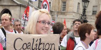 Marcher makes her point about the coalition’s cuts – local government funding has been cut by over 40 per cent by the coalition
