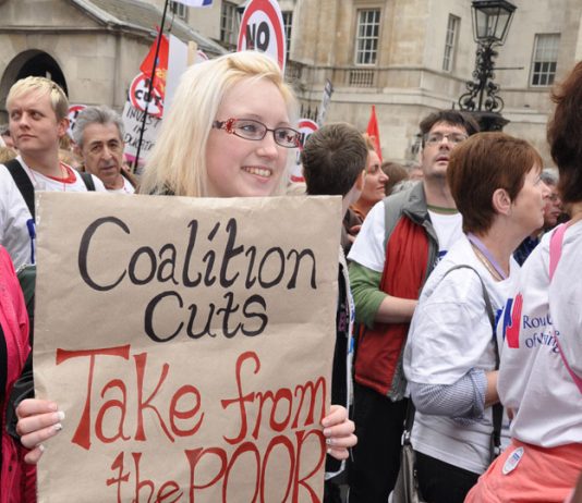 Marcher makes her point about the coalition’s cuts – local government funding has been cut by over 40 per cent by the coalition