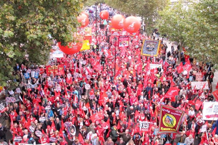 Unite banners assemble on London’s Embankment at the front of Saturday’s 150,000-strong march