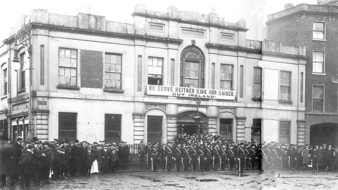 Irish Citizens Army members parade outside Liberty Hall