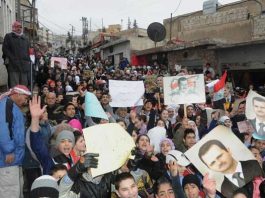 Syrians show their support for President Assad in Al Naabeck