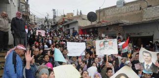 Syrians show their support for President Assad in Al Naabeck