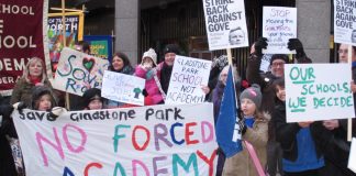 Teachers, parents and pupils demonstrate against academy schools