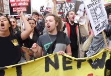 Angry students marching through central London demanding an end to all tuition fees, the restoration of grants and no privatisation