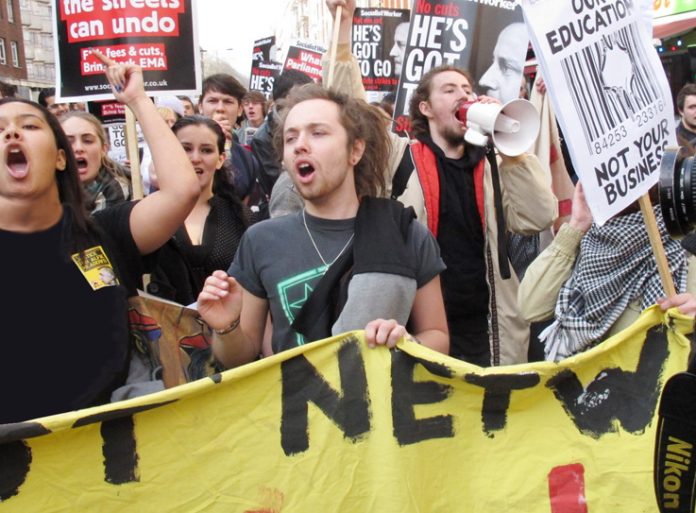 Angry students marching through central London demanding an end to all tuition fees, the restoration of grants and no privatisation