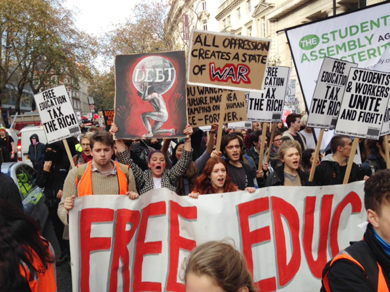 Students marched from the University of London Union to Parliament yesterday demanding free state education. In Parliament Square they tore down the fences and occupied