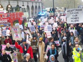 The mass march passes the Ritz Hotel – there is a growing gulf between the rich and poor in London, with working families being driven out of the capital
