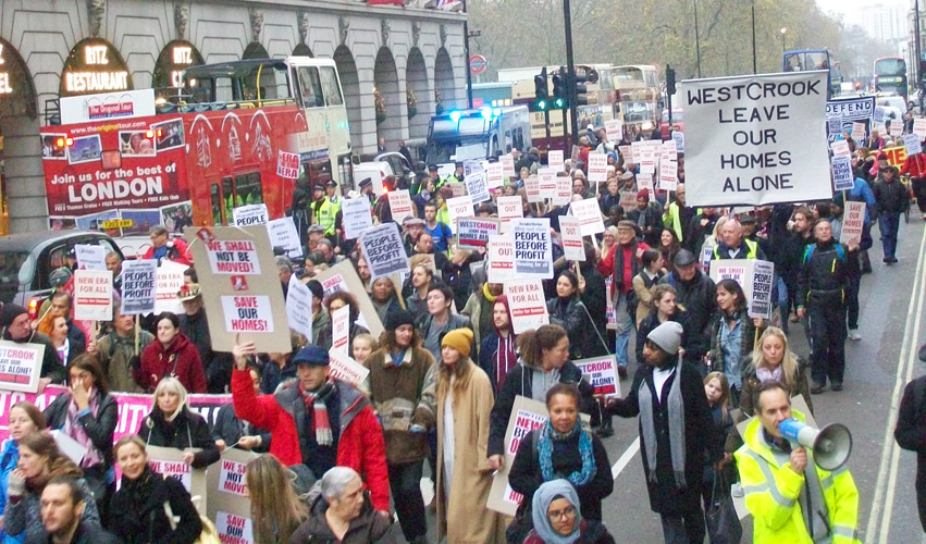 The mass march passes the Ritz Hotel – there is a growing gulf between the rich and poor in London, with working families being driven out of the capital