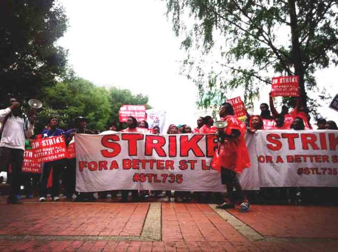 Striking fast food workers  demanding $15 an hour in St Louis