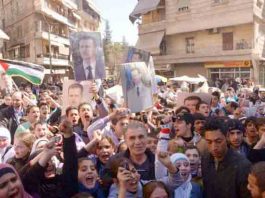 Syrians show their support for president Assad and the Palestinian struggle