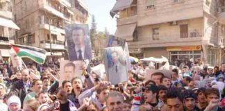 Syrians show their support for president Assad and the Palestinian struggle