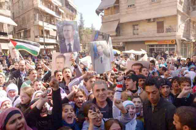 Syrians show their support for president Assad and the Palestinian struggle