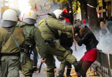 Greek riot police attack a young female demonstrator in Athens last Saturday. Photo credit: Left.gr