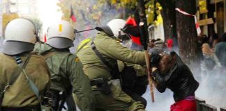 Greek riot police attack a young female demonstrator in Athens last Saturday. Photo credit: Left.gr