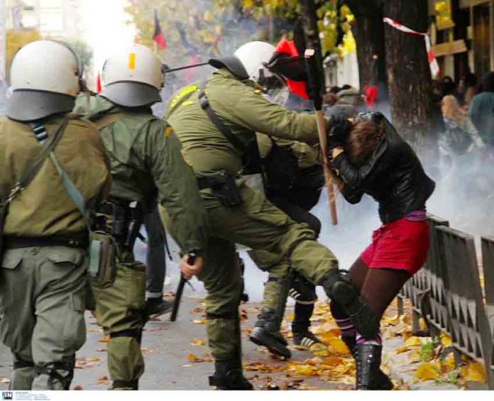 Greek riot police attack a young female demonstrator in Athens last Saturday. Photo credit: Left.gr