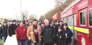 Victimised firefighter RICKY MATTHEWS (left centre) with FBU general secretary MATT WRACK at yesterday’s march in Aylesbury