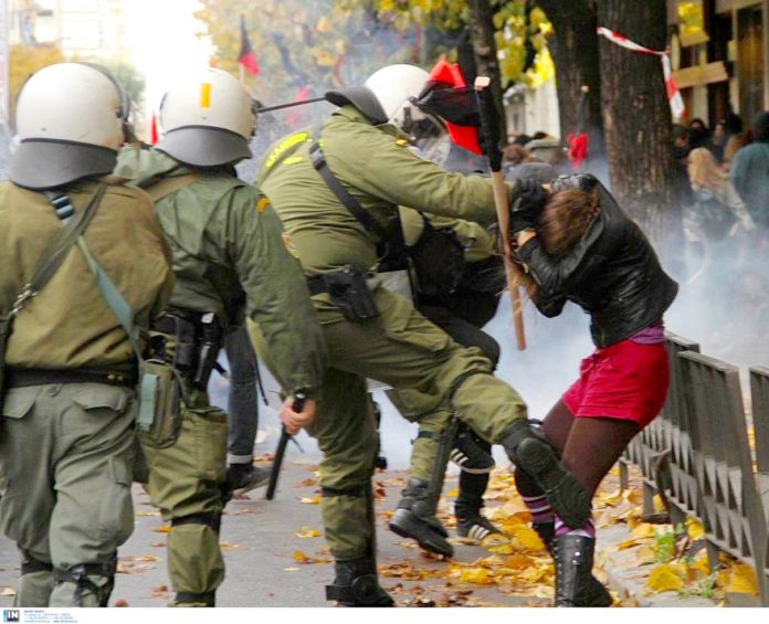 Greek soldier kicking a girl on a demonstration in Athens on the anniversary of the police shooting of 15-year-old Alexis Grigoropoulis. Photo credit: Left.gr