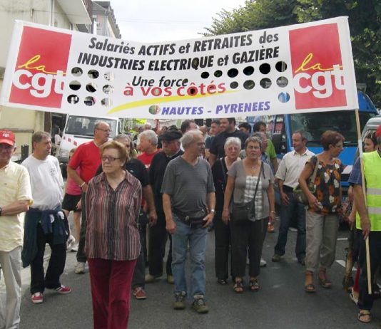 CGT members marching against pay and pension cuts for gas and electricity workers