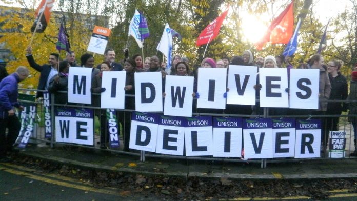 Midwives with their message as hundreds turned out for the picket at Northwick Park Hospital in Harrow
