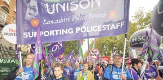 Unison police staff and their families marching against privatisation of the service – they will be striking over pay next Friday