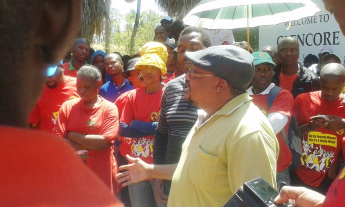 NUMSA deputy general secretary KARL CLOETE addressing his members at a rally outside the Glencore mining corporation offices