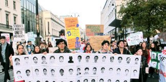 Students on a demonstration against tuition fees in London last November holding pictures of the 43 disappeared Mexican students