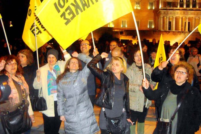 Sacked schools’ guards, part of the 10,000-strong workers’ protest outside the Greek parliament that defied the European Central Bank and shouted ‘We will not be blackmailed’