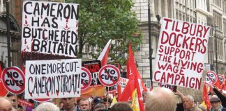 Trade unionists made their mind up about the role that Cameron and the Tory Party were playing a long time ago – picture shows placards from the October 2012 TUC demonstration against austerity in London
