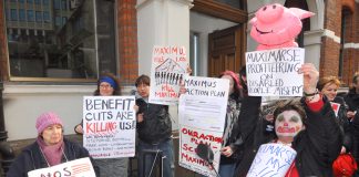 A section of yesterday’s 100-strong demonstration outside the offices of Maximus, the company taking over the work capability assessment from ATOS
