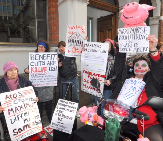 A section of yesterday’s 100-strong demonstration outside the offices of Maximus, the company taking over the work capability assessment from ATOS