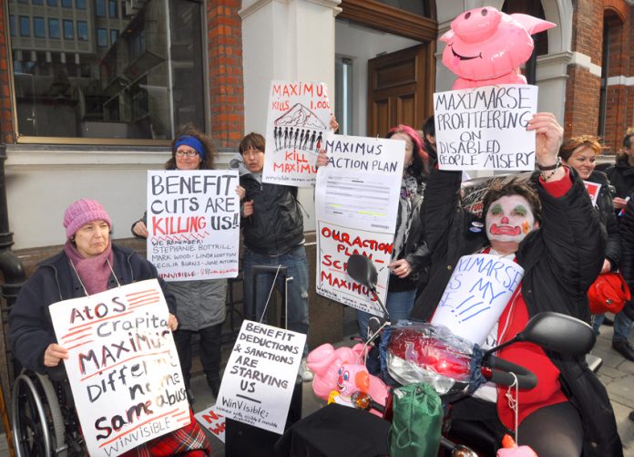 A section of yesterday’s 100-strong demonstration outside the offices of Maximus, the company taking over the work capability assessment from ATOS