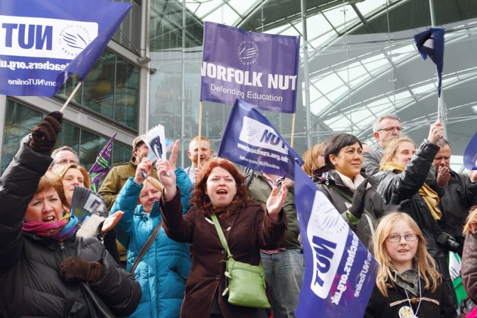 Teachers rally in Norwich during the strike in March last year – they are opposing Free Schools